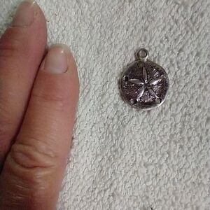 Silvertone sand dollar pendant
